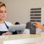 A woman is making a card payment.